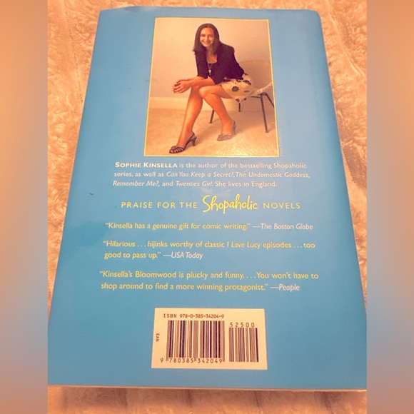 This is a wonderful hardcover book titled "Mini Shopaholic" by Sophie Kinsella. - Picture 2 of 2